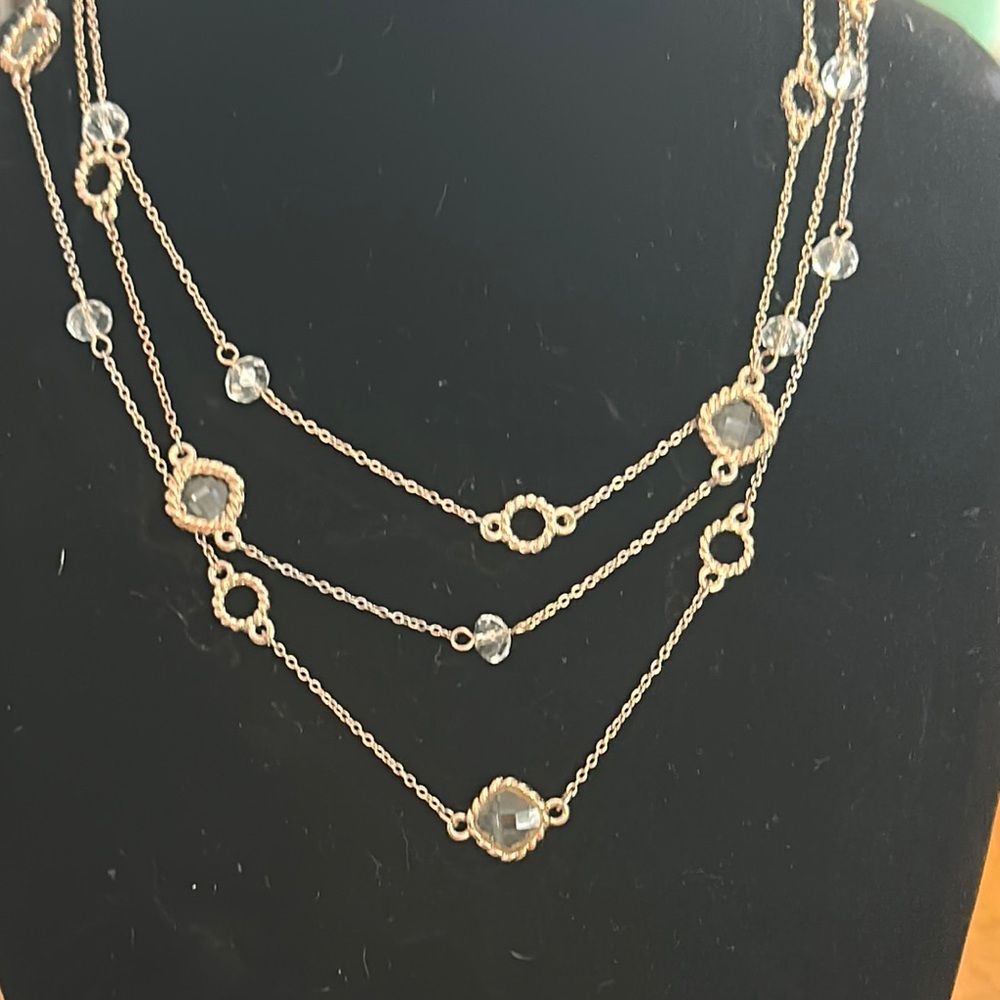 Rose goldtone and crystal 3 tier necklace. Claw clasp with ext chain.